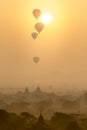 Hot air balloons fly over the pagoda ancient city field on silhouette sunrise scene at Bagan Myanmar Royalty Free Stock Photo