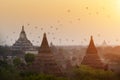 Hot air balloons flying over ancient pagodas with beautiful sunrise sky at Bagan, Myanmar. Asia travel destination. Royalty Free Stock Photo