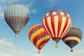 Hot air balloons flying over blue sky