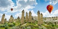 Hot air balloons flying over Love valley at Cappadocia, Turkey