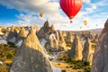 Hot air balloons flying over rocks near Goreme village. Cappadocia. Turkey Royalty Free Stock Photo