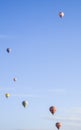 Hot air balloons flying over rocks and valley landscape at Cappadocia near Goreme Turkey Royalty Free Stock Photo