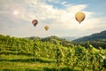 Hot air balloons flying over the vineyards along South Styrian Wine Road, Austria Royalty Free Stock Photo