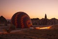 Hot air balloons are getting ready to fly at sunrise in Cappadocia Turkey Royalty Free Stock Photo