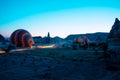 Hot air balloons are getting ready to fly at sunrise in Cappadocia Turkey Royalty Free Stock Photo