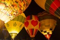 Hot air balloons glow at night float in festival Royalty Free Stock Photo