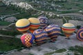 Hot air balloons are inflated prior to takeoff at Goreme in Turkey. Royalty Free Stock Photo