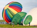 Hot air balloons inflating and getting ready for take off during Saga International Balloon Fiesta in Japan Royalty Free Stock Photo