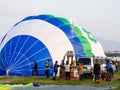 Hot air balloons inflating and getting ready for take off during Saga International Balloon Fiesta in Japan Royalty Free Stock Photo