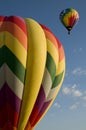 Hot air balloons launching against a blue sky