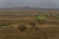 Hot air balloons over desert pastureland of Morocco