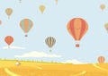 Hot air balloons over fields Royalty Free Stock Photo