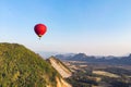 Hot air balloons over karst hills along Nam Song Xong river, Vang Vieng Royalty Free Stock Photo