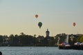 Hot air balloons over a lake in Poland view during sunset