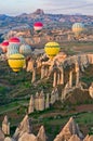 Hot air balloons over mountain landscape in Cappadocia Royalty Free Stock Photo
