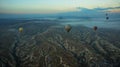 Hot air balloons over mountain landscape in Cappadocia, Goreme National Park, Turkey. Aerial view from air balloon Royalty Free Stock Photo