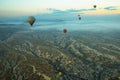 Hot air balloons over mountain landscape in Cappadocia, Goreme National Park, Turkey. Aerial view from air balloon Royalty Free Stock Photo