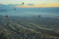 Hot air balloons over mountain landscape in Cappadocia, Goreme National Park, Turkey. Aerial view from air balloon Royalty Free Stock Photo