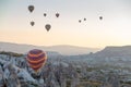 Hot air balloons over mountain landscape in Cappadocia, Goreme National Park, Turkey. Royalty Free Stock Photo