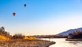 Hot air balloons over the Rio Grande river in Albuquerque New Mexico, Sandia mountains Royalty Free Stock Photo