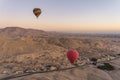 Hot air Balloons over Valley of the King in Luxor city in a morning sunrise, Upper Egypt Royalty Free Stock Photo