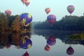 Hot air balloons over water