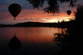 Hot-Air Balloons over Water at Sunset Sunrise Royalty Free Stock Photo