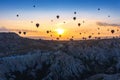 Hot air balloons and Red valley  at sunrise in Goreme, Cappadocia in Turkey Royalty Free Stock Photo