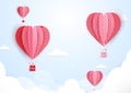 Hot air balloons in shape of heart flying in clouds. paper art Royalty Free Stock Photo