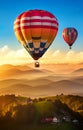 Hot Air Balloons in the Sky Floating Over a Hill with Houses and Forests