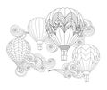 Hot air balloons in the sky. Zentangle inspired doodle style isolated on white. Royalty Free Stock Photo