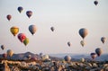 Hot air balloons at sunrise flying over Cappadocia, Turkey. A balloon with a flag of Turkey Royalty Free Stock Photo