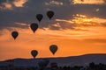 Hot air balloons take off at sunrise over Cappadocia, Goreme, Turkey Royalty Free Stock Photo