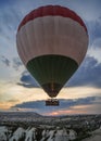 Hot air balloons take off at sunrise over Cappadocia,