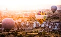 Hot air balloons between the texture of rocks in cappadoccia at sunrise Royalty Free Stock Photo