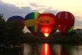 Hot air baloon starting to fly in the evening sky Royalty Free Stock Photo