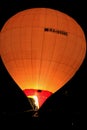 Hot air baloon starting to fly in the evening sky Royalty Free Stock Photo