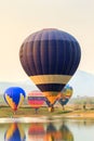 Hot air color balloon over lake with sunset time, Chiang Rai Province, Thailand Royalty Free Stock Photo