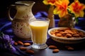 hot almond milk with saffron beside diwali lamps