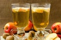 Hot apple cider with apples and slices in cups Royalty Free Stock Photo