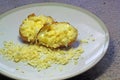 Hot baked jacket potato with melted cheese.