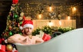 Hot bath health benefits. Santa Claus luxuriate in warm bath. Take delight. Pampering myself. Winter holidays. New year Royalty Free Stock Photo