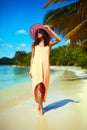 Hot beautiful woman in colorful sunhat on beach Royalty Free Stock Photo