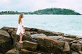 Hot beautiful woman in colorful sunhat and dress walking near Royalty Free Stock Photo