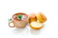 Hot beetroot soup with sour cream, herbs and rolls in a ceramic bowl Royalty Free Stock Photo