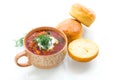 hot beetroot soup with sour cream, herbs and rolls in a ceramic bowl Royalty Free Stock Photo