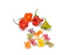 Hot bell peppers and colored pasta on a white background Royalty Free Stock Photo