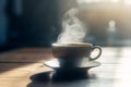 A hot black coffee in a cup on wooden table in the morning provide. Royalty Free Stock Photo