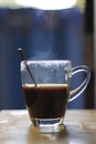 Hot black coffee glass placed on table in the morning. Royalty Free Stock Photo