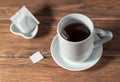 Hot black tea cup with a tea bag on a table Royalty Free Stock Photo